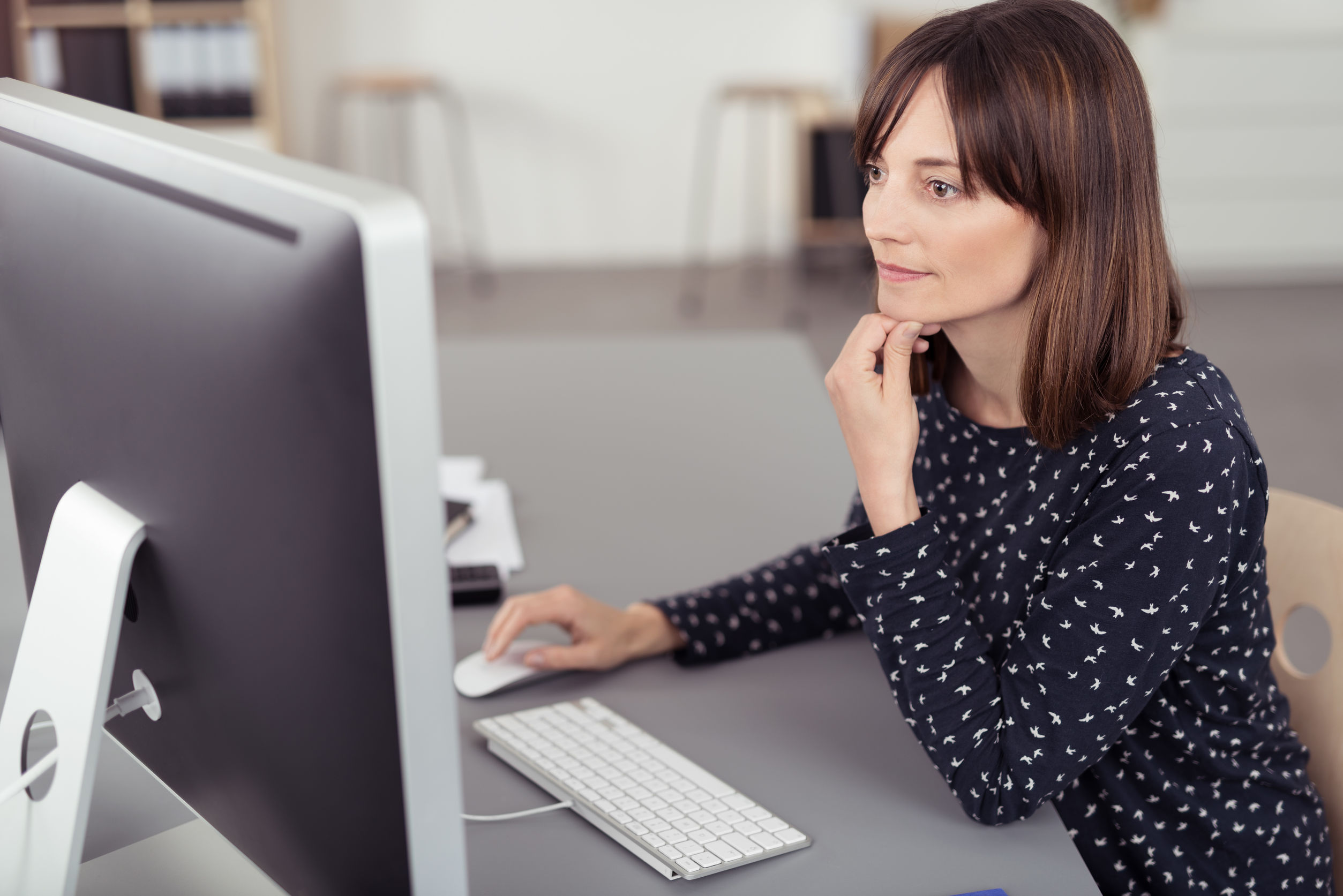 Woman using desktop computer