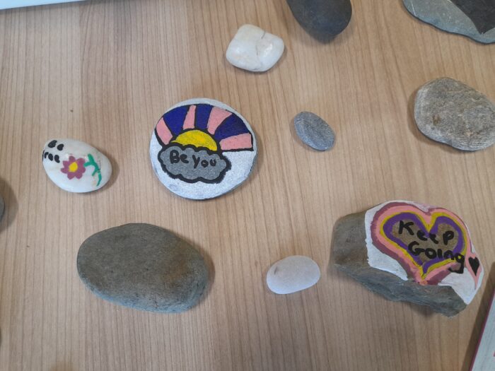 writing positive messages on stones