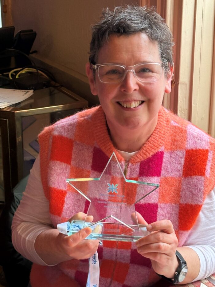 Helen with award